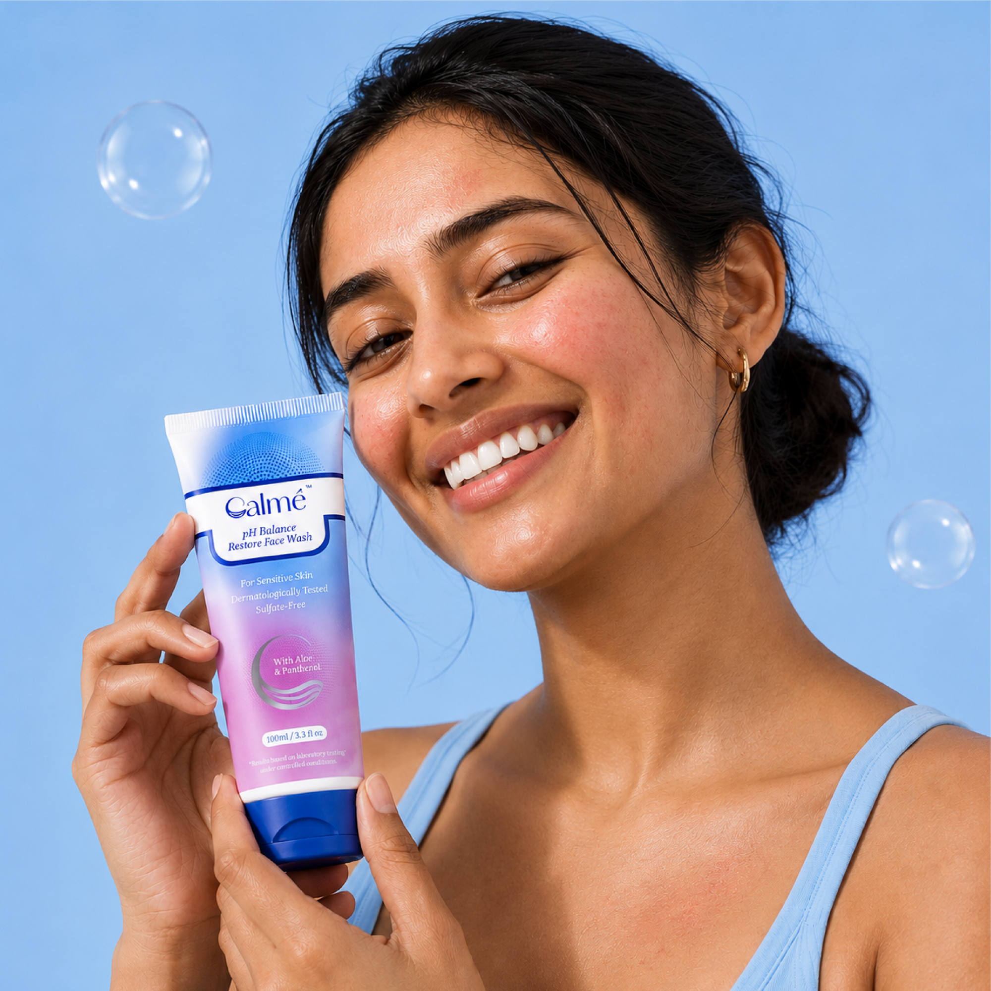 Woman holding a Calme product against a blue background